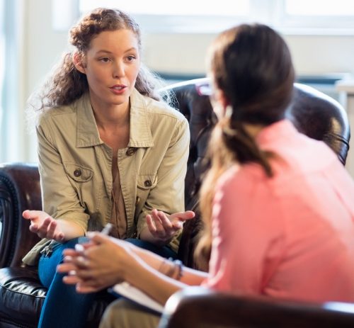 photo of two people talking